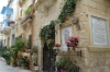 Decorated houses in narrow street in Rabat, Malta