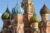 Detail on the onion domes of St Basil's Cathedral in evening sun, Red Square, Moscow RU.