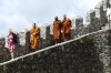 Monks climbing the walls of the 12th Century Moorish Castle, Sintra PT