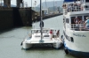 First lock of the Panama Canal.  Catamaran ties up to another tourist boat.