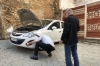 Bruce and our very big helper from the hotel in Prizren making some temporary repairs to the car. Prizren XK