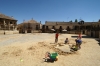 Children play in the sand, where a bull ring was under construction, in the town centre of Pedruza del al Sierra. ES