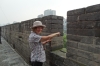 Thea pointing west to the Silk Road from the ancient city wall of Xi'an CN